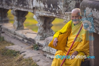 An Unidentified Old Buddhist Female Monk Dressed In Orange Toga Stock Photo