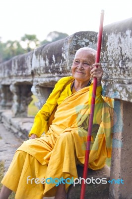 An Unidentified Old Buddhist Female Monk Dressed In Orange Toga Stock Photo