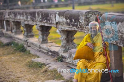 An Unidentified Old Buddhist Female Monk Dressed In Orange Toga Stock Photo