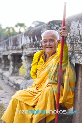 An Unidentified Old Buddhist Female Monk Dressed In Orange Toga Stock Photo