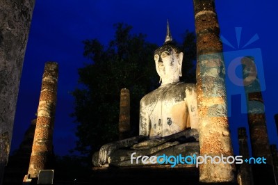 Ancient Buddha Statue At Twilight, Wat Mahathat In Sukhothai His… Stock Photo