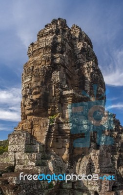 Ancient Stone Face Of Bayon Temple Stock Photo