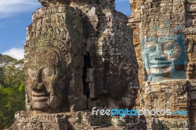 Ancient Stone Face Of Bayon Temple Stock Photo