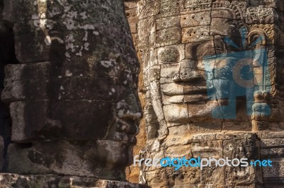 Ancient Stone Face Of Bayon Temple Stock Photo