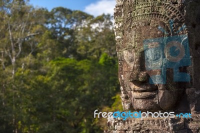 Ancient Stone Face Of Bayon Temple Stock Photo