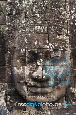 Ancient Stone Face Of Bayon Temple Stock Photo