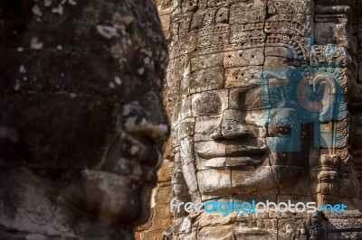 Ancient Stone Face Of Bayon Temple Stock Photo