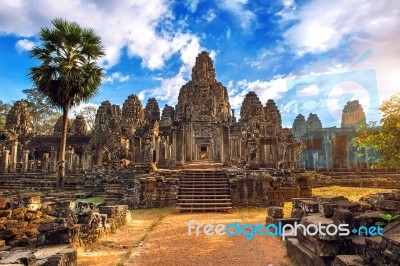 Ancient Stone Faces At Sunset Of Bayon Temple, Angkor Wat, Siam Reap, Cambodia Stock Photo