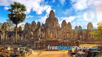 Ancient Stone Faces At Sunset Of Bayon Temple, Angkor Wat, Siam Reap, Cambodia Stock Photo