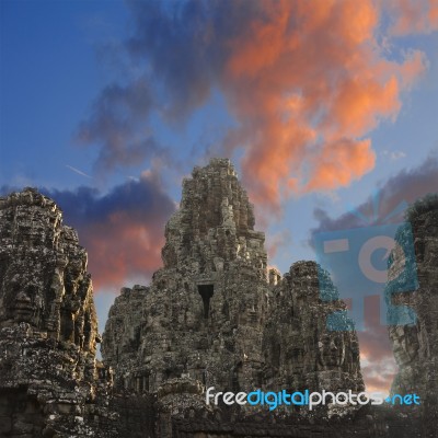 Ancient Stone Faces Of King Jayavarman Vii At The Bayon Temple, Stock Photo