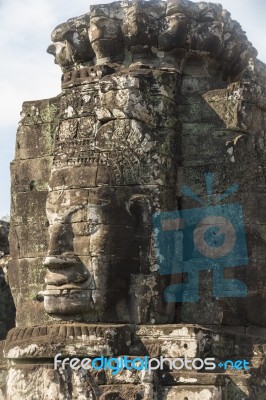 Ancient Stone Faces Of King Jayavarman Vii At The Bayon Temple, Stock Photo