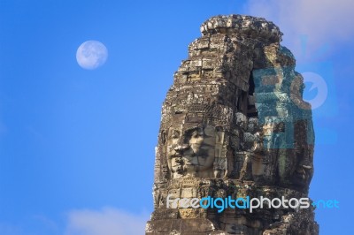 Ancient Stone Faces Of King Jayavarman Vii At The Bayon Temple, Stock Photo