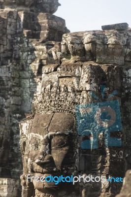 Ancient Stone Faces Of King Jayavarman Vii At The Bayon Temple, Stock Photo