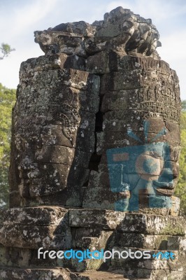 Ancient Stone Faces Of King Jayavarman Vii At The Bayon Temple, Stock Photo