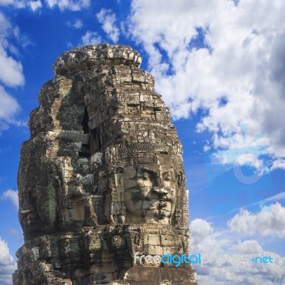 Ancient Stone Faces Of King Jayavarman Vii At The Bayon Temple, Stock Photo