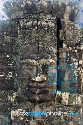 Ancient Stone Faces Of King Jayavarman Vii At The Bayon Temple, Stock Photo