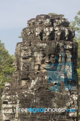 Ancient Stone Faces Of King Jayavarman Vii At The Bayon Temple, Stock Photo