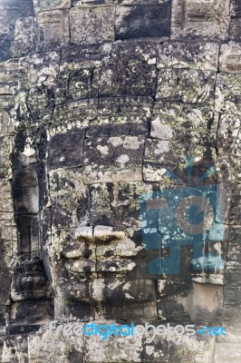 Ancient Stone Faces Of King Jayavarman Vii At The Bayon Temple, Stock Photo