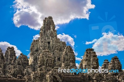 Ancient Stone Faces Of King Jayavarman Vii At The Bayon Temple, Stock Photo