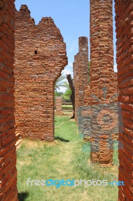 Ancient Way With Crack Brick Pole In History Park Stock Photo