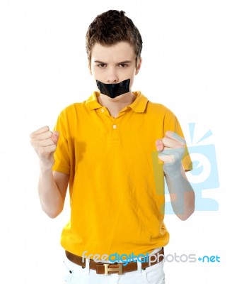 Angry Boy With Clenched Fist Stock Photo