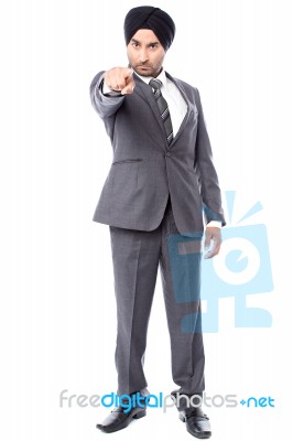 Angry Businessman Pointing Towards You Stock Photo