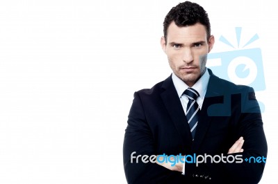 Angry Businessman With Crossed Arms Stock Photo