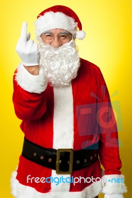 Angry Santa Showing Middle Finger Stock Photo