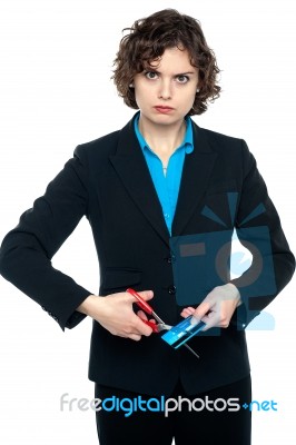 Angry Wman Cutting Cash Card With Scissors Stock Photo