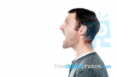 Angry Young Man Screaming Stock Photo