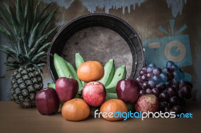 Apple And Several Kinds Of Fruits On A Wooden Table Stock Photo