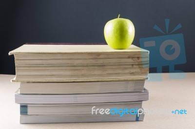 Apple On Books Stock Photo