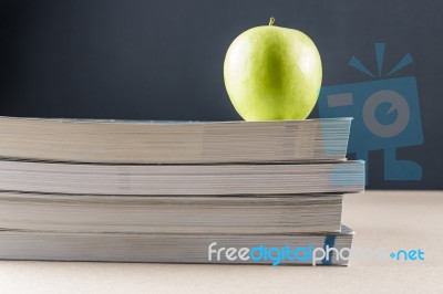 Apple On Books Stock Photo