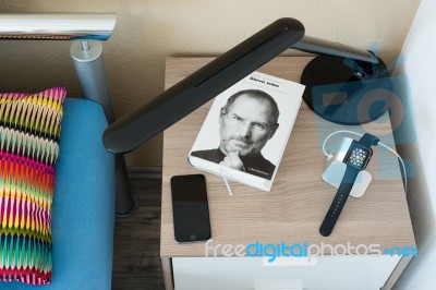 Apple Watch Being Charged On The Bedside Table Stock Photo