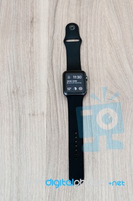 Apple Watch Sport On The Table With Clock Screen Stock Photo