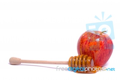 Apple With Honey Dipper Stock Photo