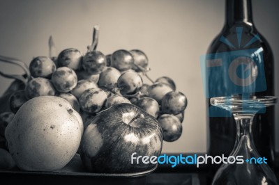 Apples And A Glass With Black And White Stock Photo