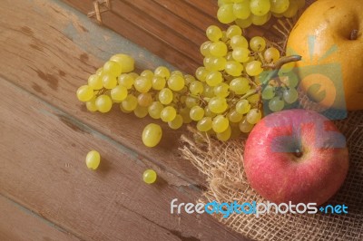 Apples And Grapes On The Table Stock Photo