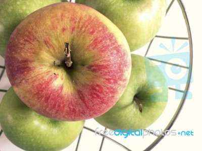 Apples On A Metallic Basket Stock Photo