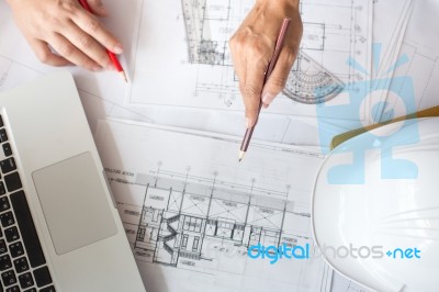 Architects Discussing At The Table With Blueprint - Closeup On H… Stock Photo