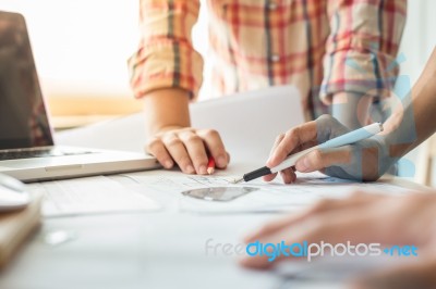 Architects Discussing At The Table With Blueprint - Closeup On H… Stock Photo