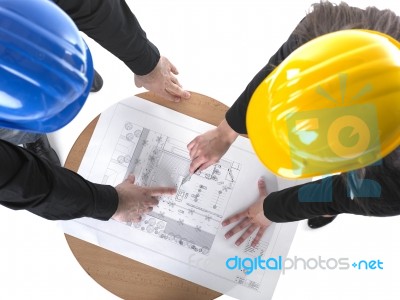 Architects discussing with plan Stock Photo