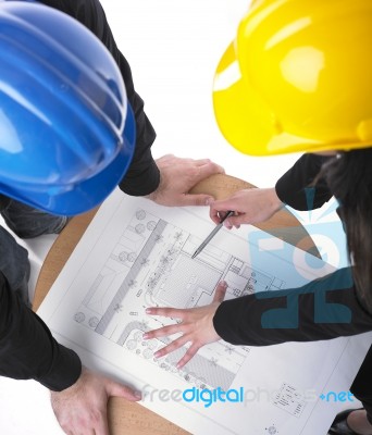 Architects discussing with plan Stock Photo