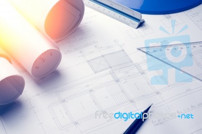 Architectural Blueprints And Blueprint Rolls And A Drawing Instr… Stock Photo