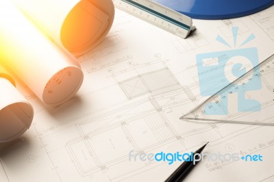 Architectural Blueprints And Blueprint Rolls And A Drawing Instr… Stock Photo