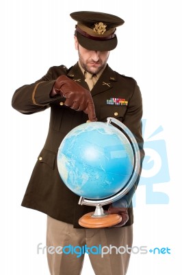 Army Man Holding Globe Tightly Stock Photo