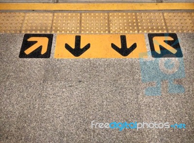 Arrow Sign On Floor At The Sky Train Stock Photo