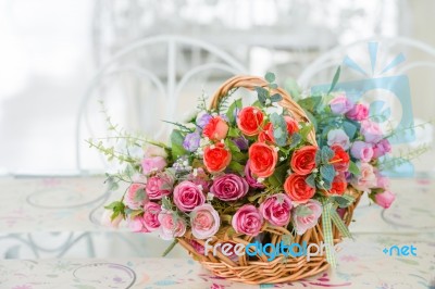 Artificial Roses In The Basket Stock Photo