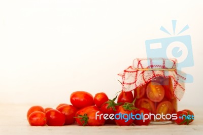 Artisanal Preparation Of Pickles Of Organic Cherry Tomatoes Stock Photo