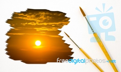 Artist Brush Painting Picture Of Sunset Stock Photo